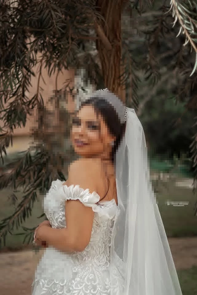 Beautiful Bride in White Lace Wedding Dress with Elegant Tiara Outdoors