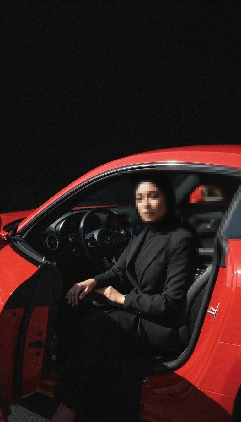 Confident Woman in Black Hijab Sitting Inside Red Luxury Car