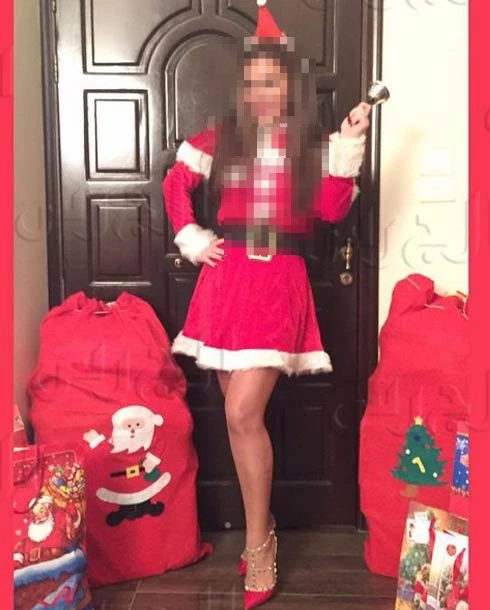 Festive Santa Outfit Celebration with Christmas Gifts and Holiday Decor