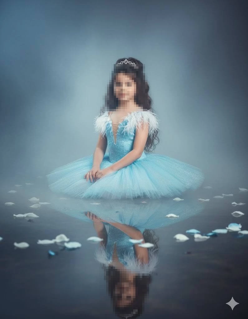 Little girl in blue princess dress with tiara sitting gracefully by reflection