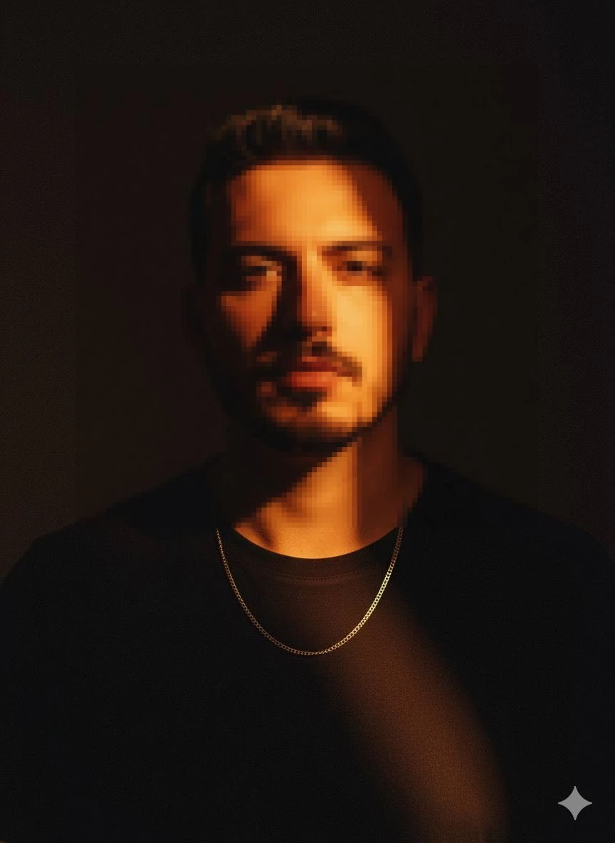 Man in Black Shirt Under Dramatic Warm Light with Cinematic Shadow
