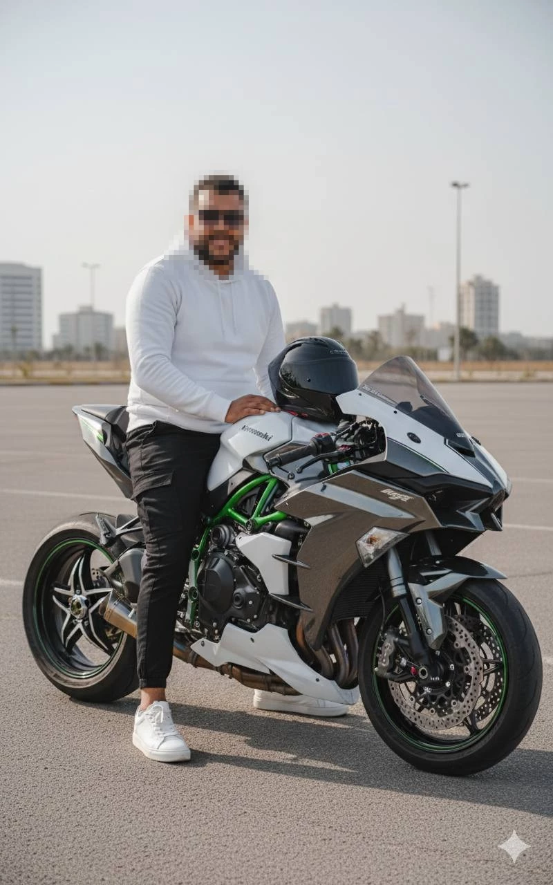 Man Sitting on Sport Motorcycle Wearing White Hoodie and Black Pants