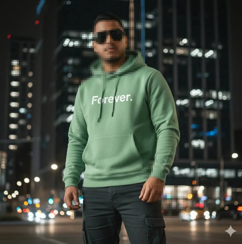 Man Wearing Green Hoodie with Forever Text Standing in City at Night
