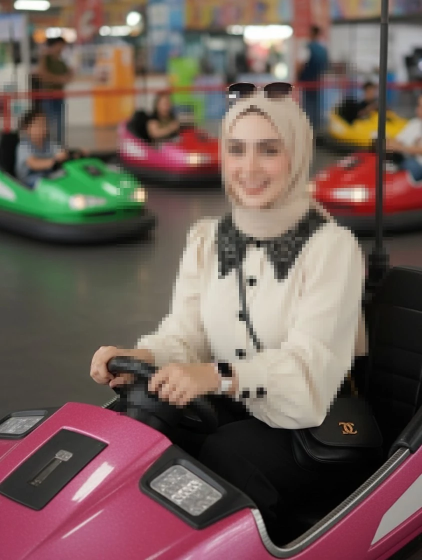 Smiling Woman in Beige Hijab Driving a Pink Bumper Car at Amusement Park