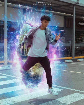 A young man leaping forward on a crosswalk