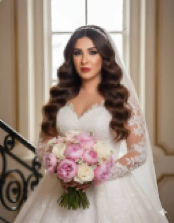 Bride in elegant lace wedding gown holding pink and white rose bouquet
