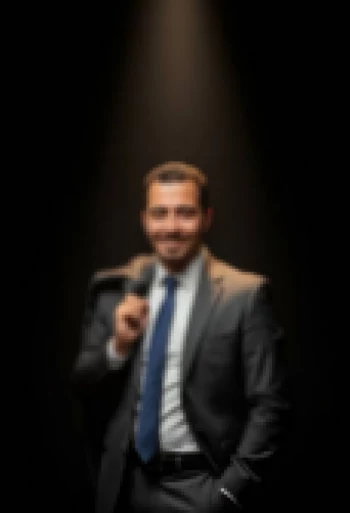 Confident Businessman in Suit Posing Under Spotlight with Charismatic Smile