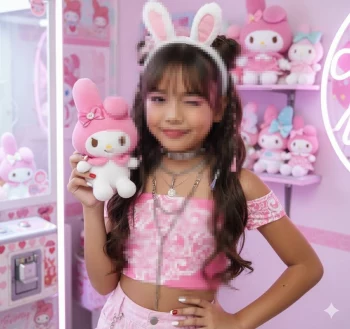 Cute Girl in Pink Outfit Holding Bunny Plush Toy in Kawaii Themed Room