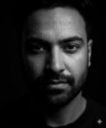 Dramatic black and white portrait of man with water droplets on his face