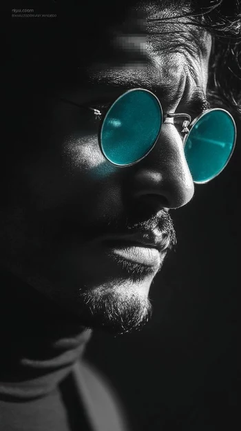 Dramatic Close-Up Portrait of a Man Wearing Blue Tinted Round Glasses
