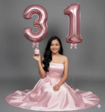 Elegant 31st birthday photoshoot with woman in pink satin gown holding cupcake