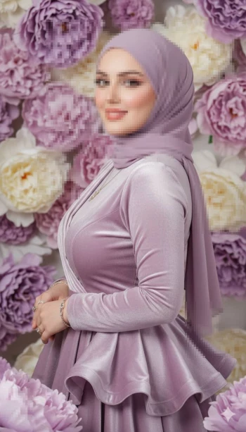 Elegant portrait of a woman in a lavender dress with a floral backdrop