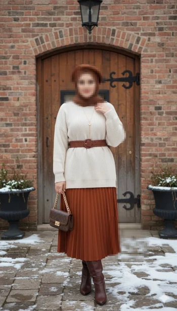 Elegant winter portrait of a woman in warm earth-tone outfit by a rustic door