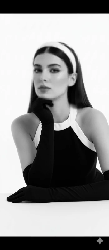 Elegant woman in black and white outfit with gloves in minimalist studio style