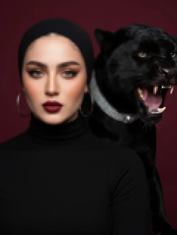 Elegant Woman in Black with Fierce Panther in Dramatic Studio Portrait