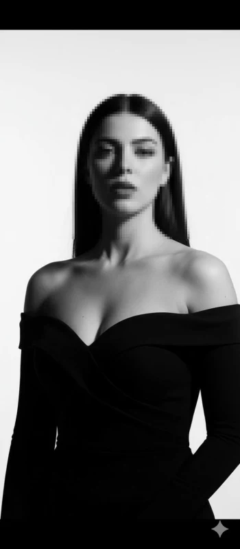 Elegant woman in off-shoulder black dress in timeless black and white portrait