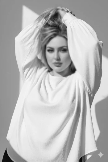 Elegant Woman in White Blouse Posing Gracefully in Black and White Portrait