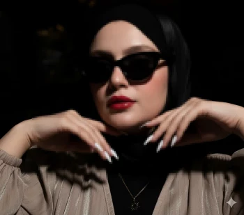 Elegant woman in white hijab posing gracefullyStylish woman in black hijab and sunglasses with red lipstick and white nails against a minimalist white background