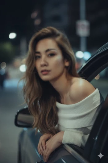 Elegant woman in white off shoulder sweater leaning from car at night