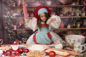 Girl Baking Christmas Cookies in a Festive Holiday Kitchen Setting