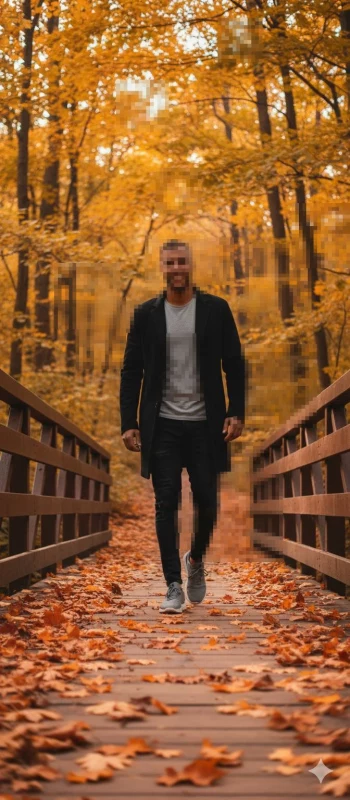 iM Man walking on autumn bridge surrounded by golden forest leaves