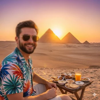 Man enjoying breakfast in the desert with the pyramids at sunrise in Egypt