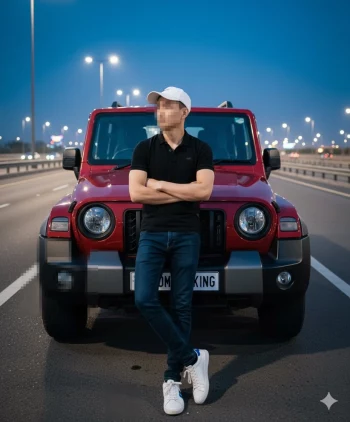 Man in black shirt and white cap standing confidently in front of red SUV at dusk