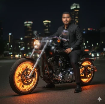 Man in Black Suit Riding Motorcycle with Glowing Fiery Wheels at Night