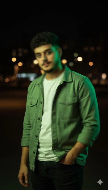 Man in green jacket posing confidently under city night lights