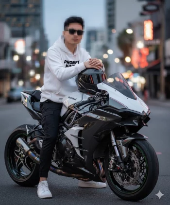 Man in white hoodie sitting on black and white Kawasaki motorcycle in city street