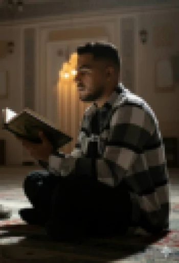 Man Reading Holy Book Inside Mosque Under Warm Spiritual Light