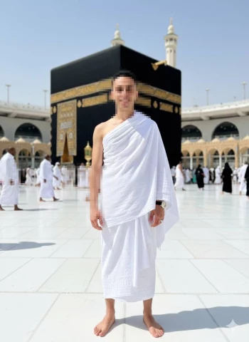Man Wearing Ihram Standing in Front of Kaaba at Masjid al-Haram Makkah
