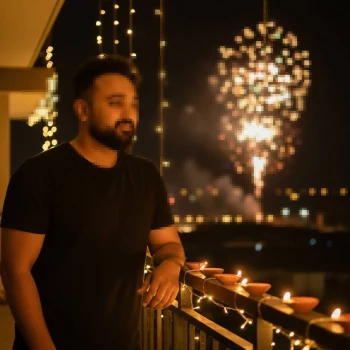 Night balcony portrait of a man with warm lights and fireworks in the background