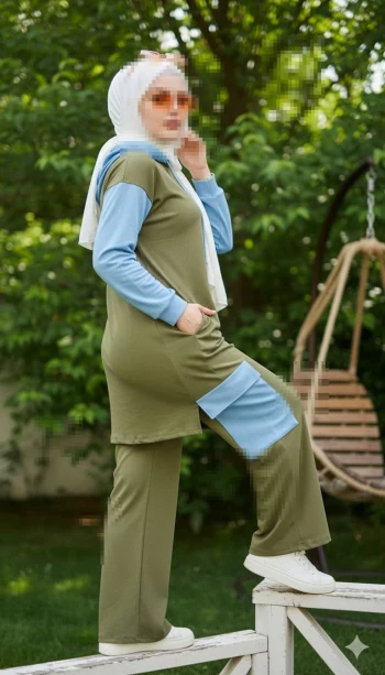 Sporty outdoor portrait of a woman in a two-tone athleisure outfit in the garden