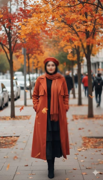 Stylish autumn street portrait of a woman in a rust-orange coat and falling leaves