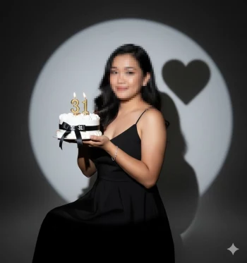 Woman celebrating 31st birthday holding cake with elegant black dress