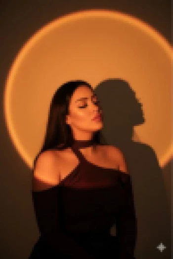 Woman in Artistic Golden Light Halo Wearing Elegant Maroon Top