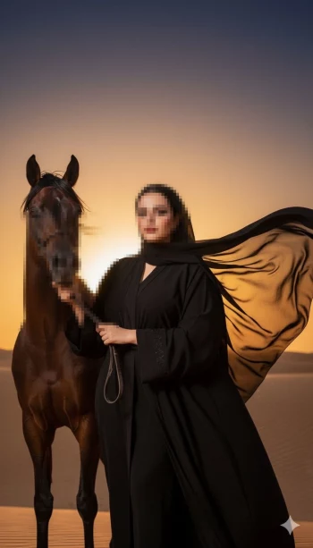 Woman in black abaya with horse in desert at sunset