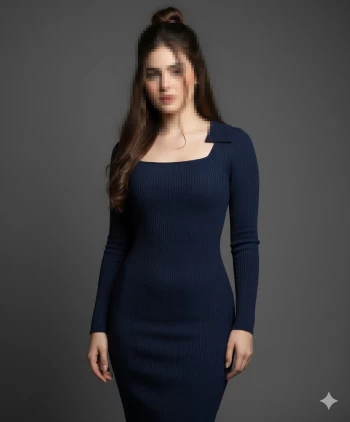 Woman in elegant navy blue ribbed dress posing against dark studio background