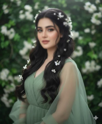 Woman in green dress with floral hair accessories standing in blooming garden