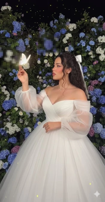 Woman in White Gown Holding Glowing Butterfly Before Floral Backdrop