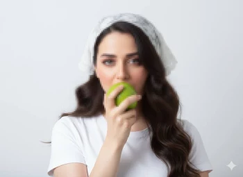 Woman in White Headscarf Holding Green Apple Against Minimalist Background