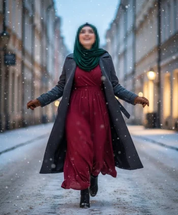 Woman sitting by café windowWoman in green hijab and maroon dress walking happily in snowy city street on a rainy day holding a cup of coffee